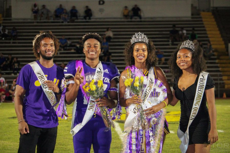 Senior King and Queen Aiven Coleman and Kaliyah Fontenot accept their crowns at half-time.