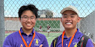 The men's double team shows off their medals.