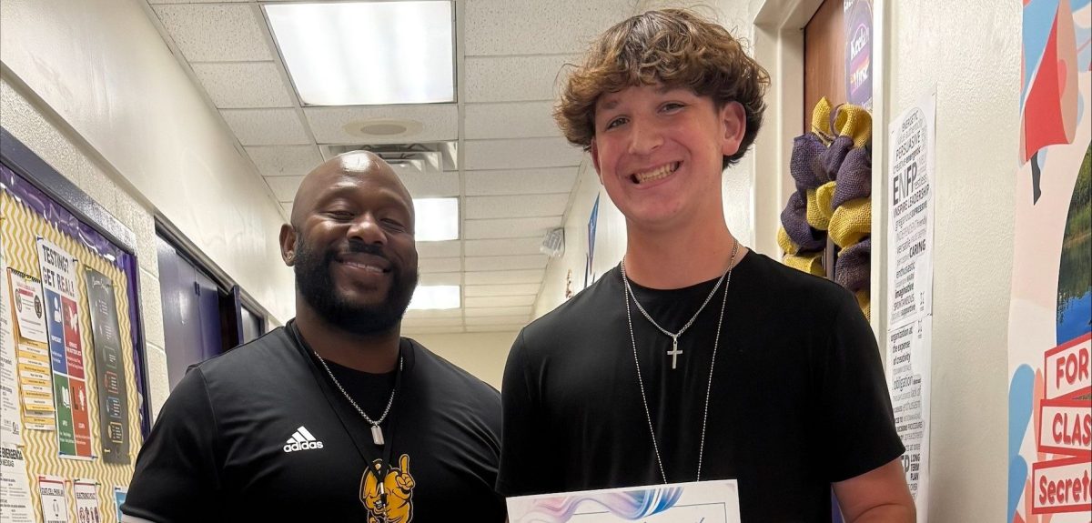 Grayson Daugherty posing with AP Keelan Muse